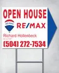 Remax Red Letters Arrow Shape Sign