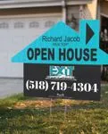 Exit Realty Turquoise and Black House Shape Sign 1