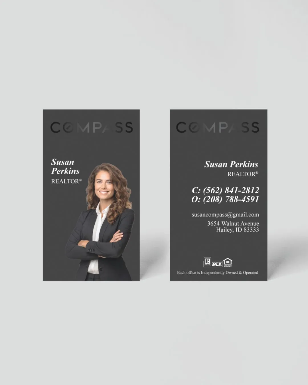 Compass Elegance in the Hands Raised Spot UV Business Cards 1