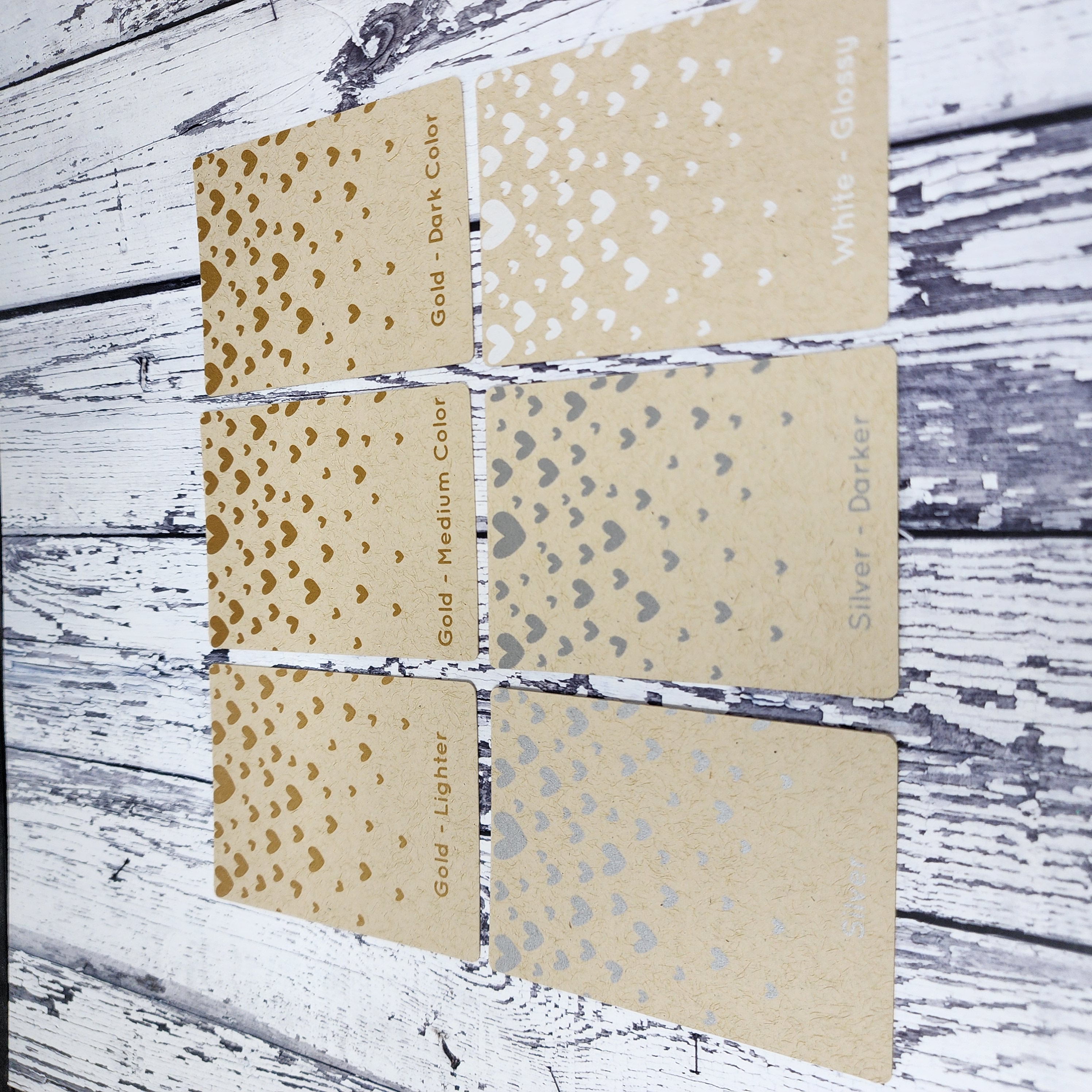Metallic ink samples on kraft paper